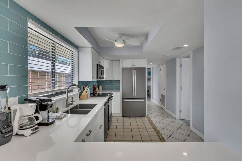 36 inch full size refrigerator and spacious bar for entertaining.