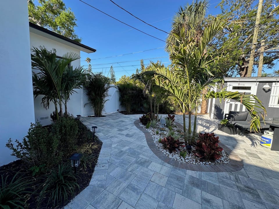 Gated Backyard with sectional outdoor furniture and firepit