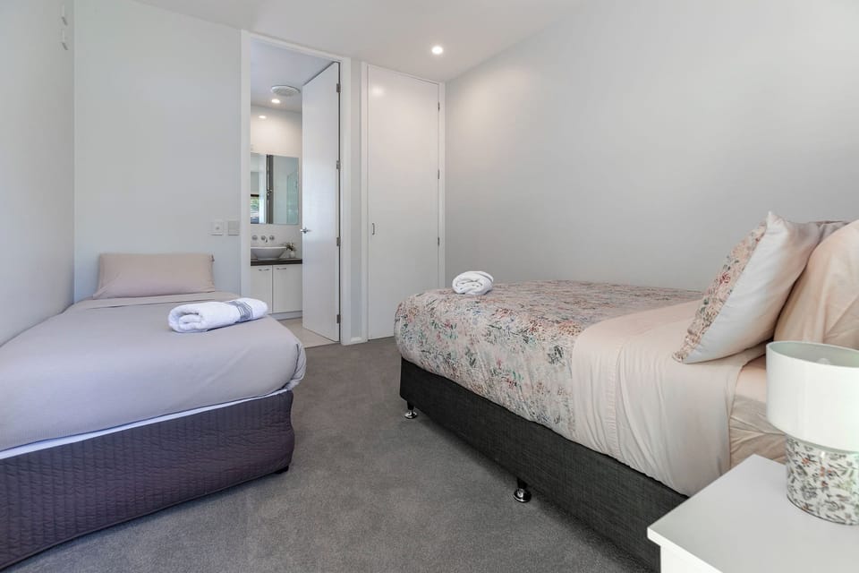Bedroom 3 with double and single beds and an ensuite.