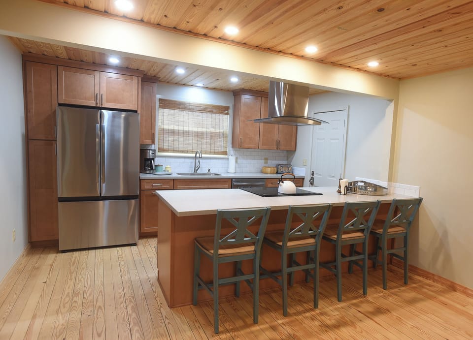 All new kitchen and island for a spot to have a quick snack or breakfast.