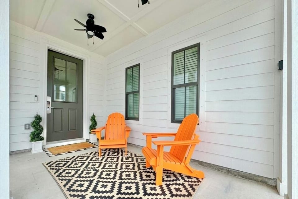 Charming porch retreat with cozy seating and stylish décor.