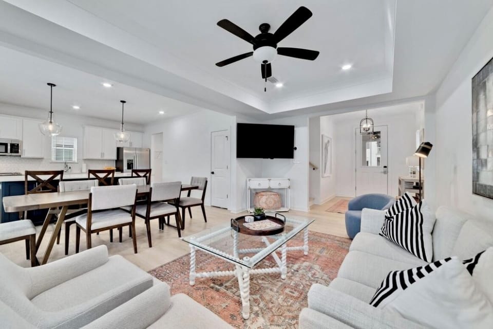 Modern open-concept living space with stylish furnishings and natural light.
