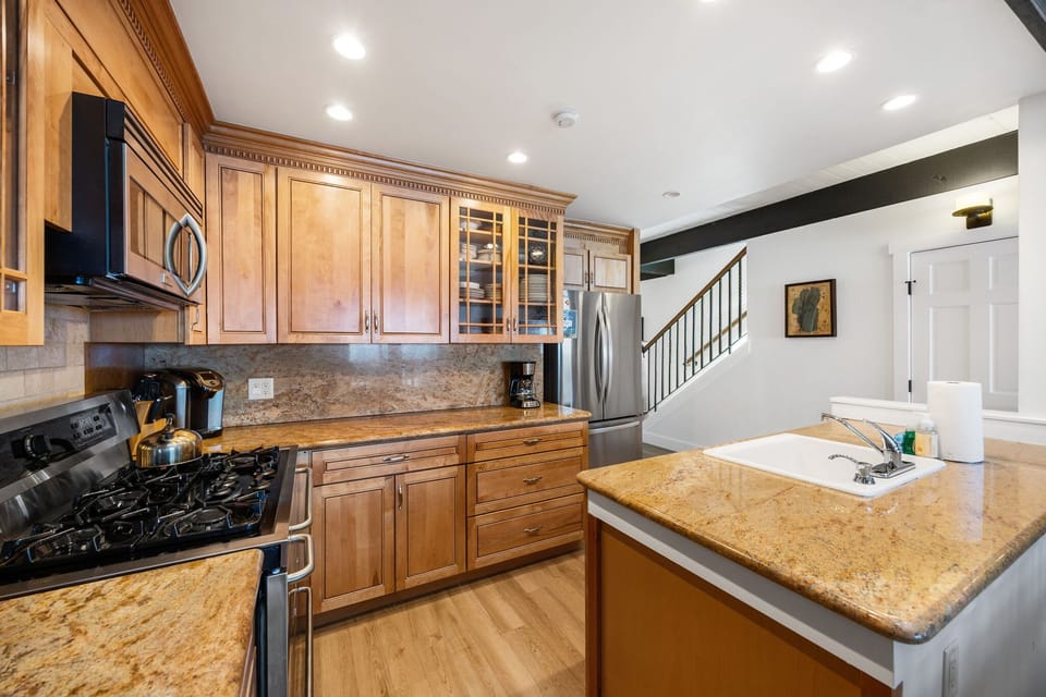 Kitchen: Keurig, toaster, cooking utensils, tableware, main floor