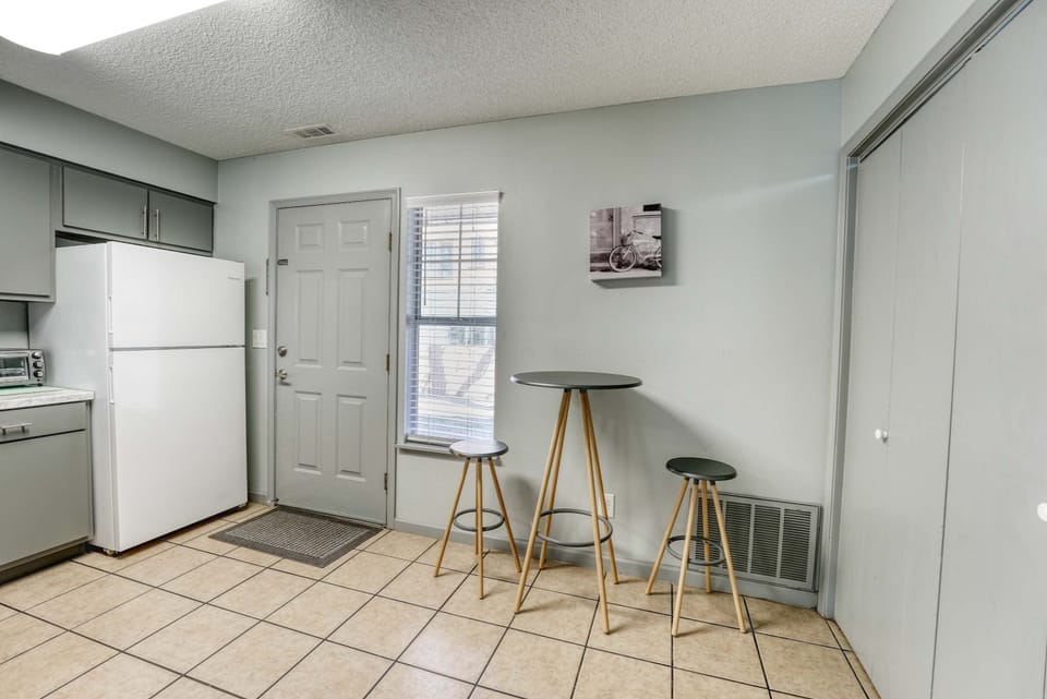 The washer and dryer are conveniently located just off the kitchen, offering easy access for a hassle-free stay.