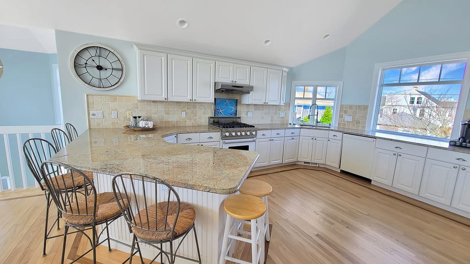 Kitchen with granite counter tops and counter seating