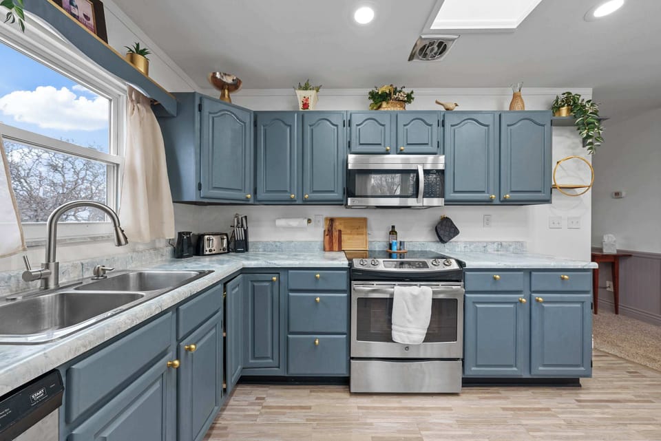 The updated eat-in kitchen offers ample space & every home comfort