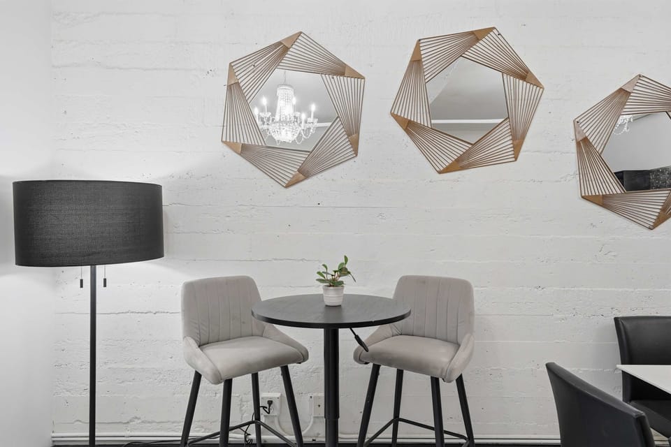Dining nook with stylish wall art and seating.