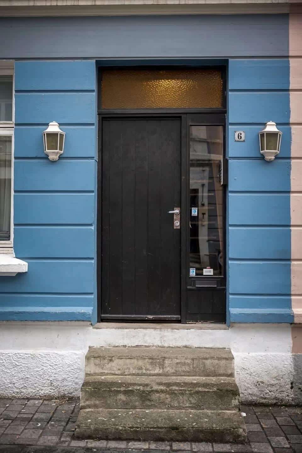 Featuring a charming blue door that welcomes you to relaxation and comfort