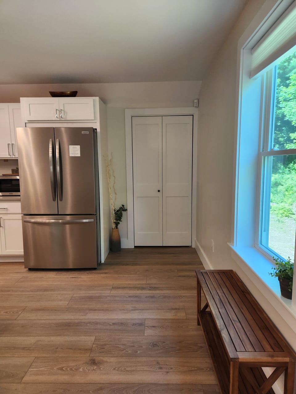 Entrance with bench seating and walk-in pantry