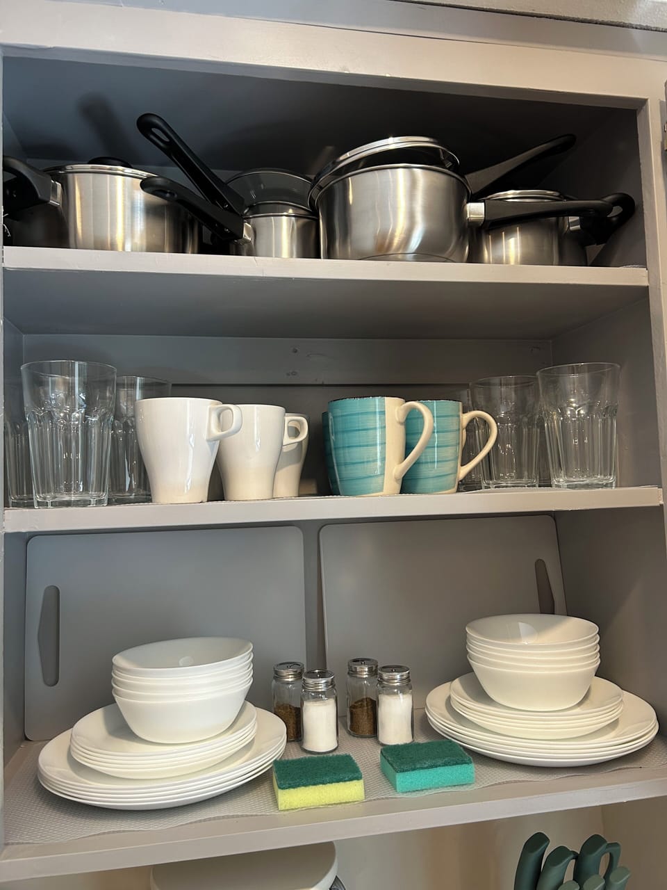 cabinets full of extra dishes and cups.