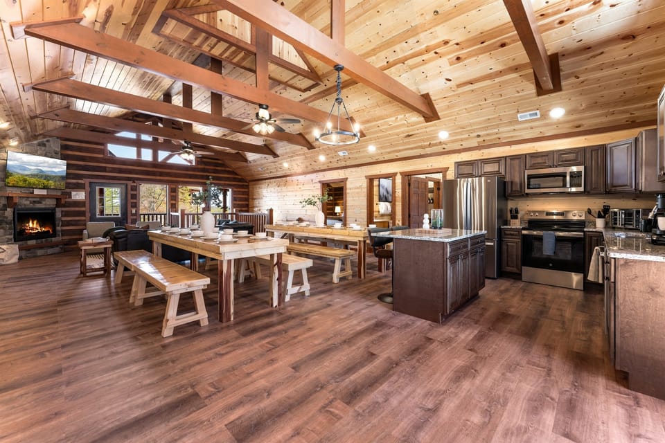 Fully equipped chef’s kitchen with granite countertops and bar seating.
