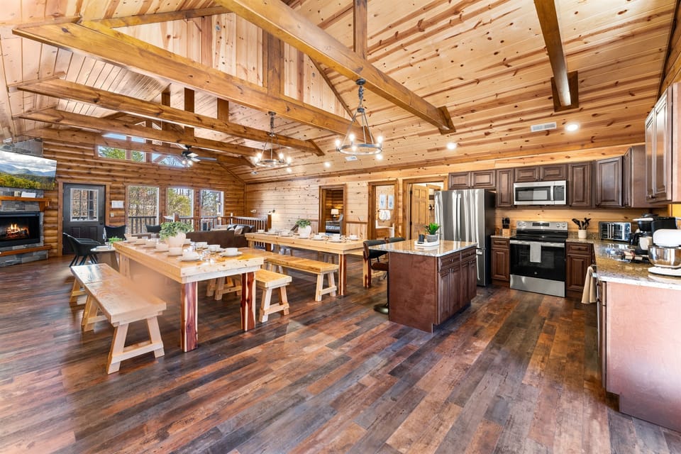 Fully equipped chef’s kitchen with granite countertops and bar seating.