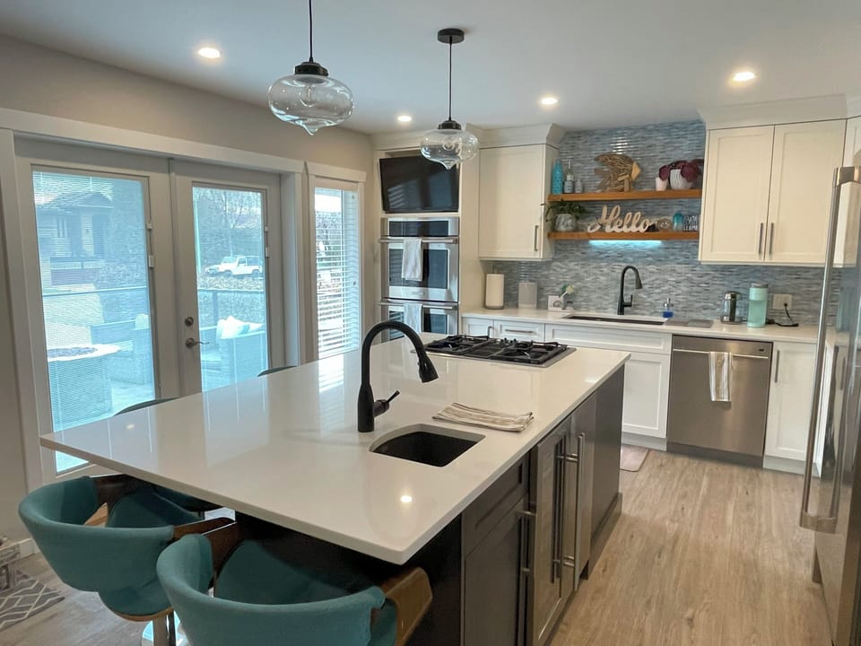 Kitchen features built-in ice maker and wine fridge