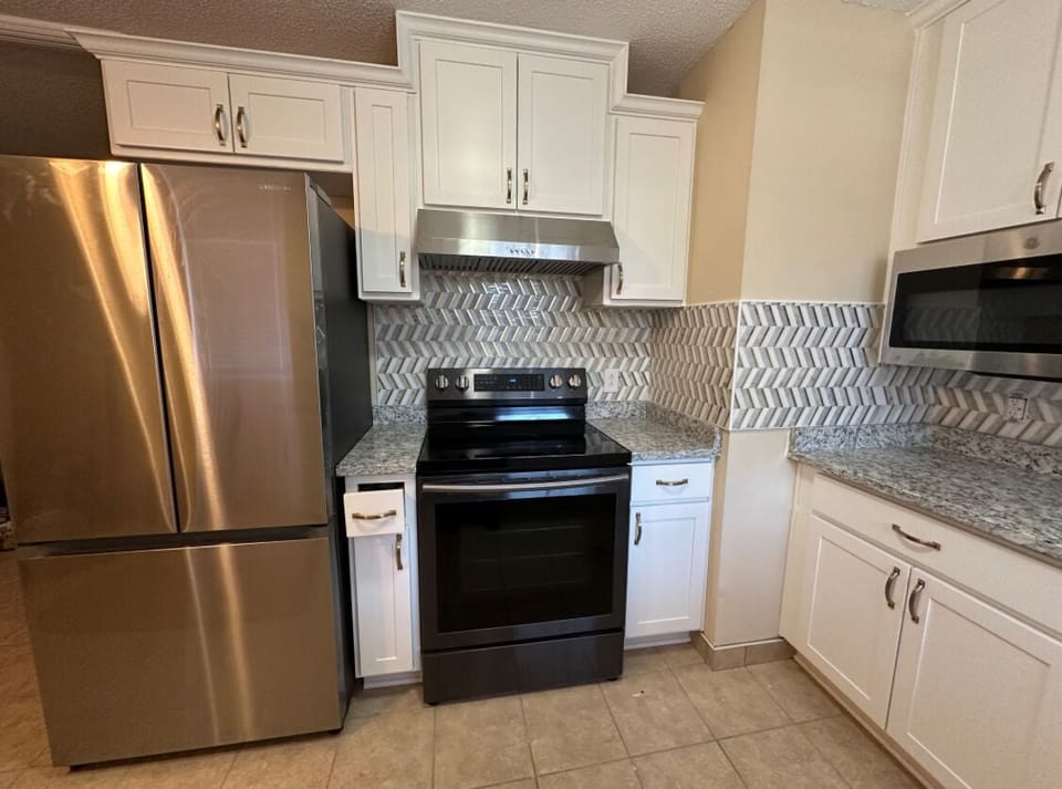 refrigerator and full kitchen