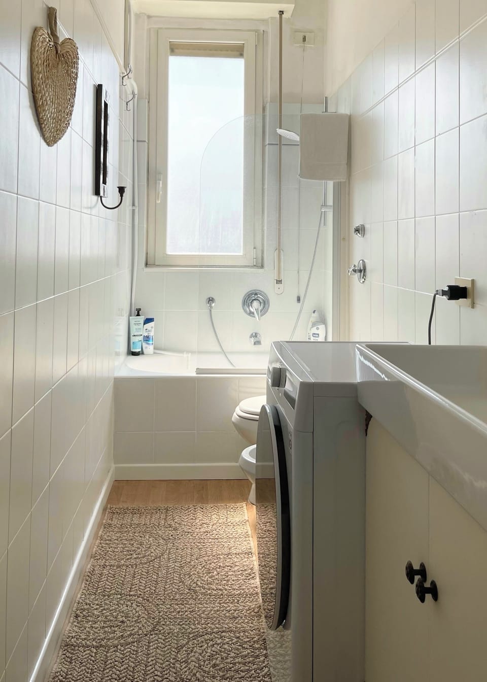 Slim LG washer-dryer, shower-tub combo.