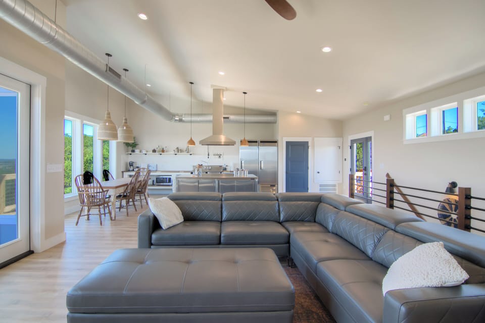 Large leather sectional couch with pop up headrests for comfort