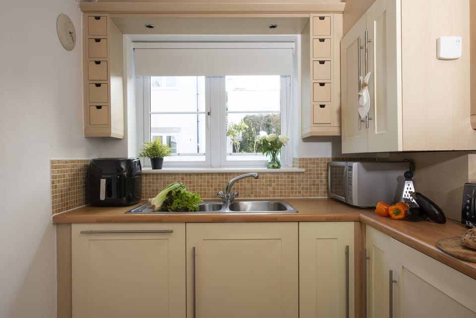 Kitchen with kettle, washer/dryer, and toaster - Bay View, Compass Point