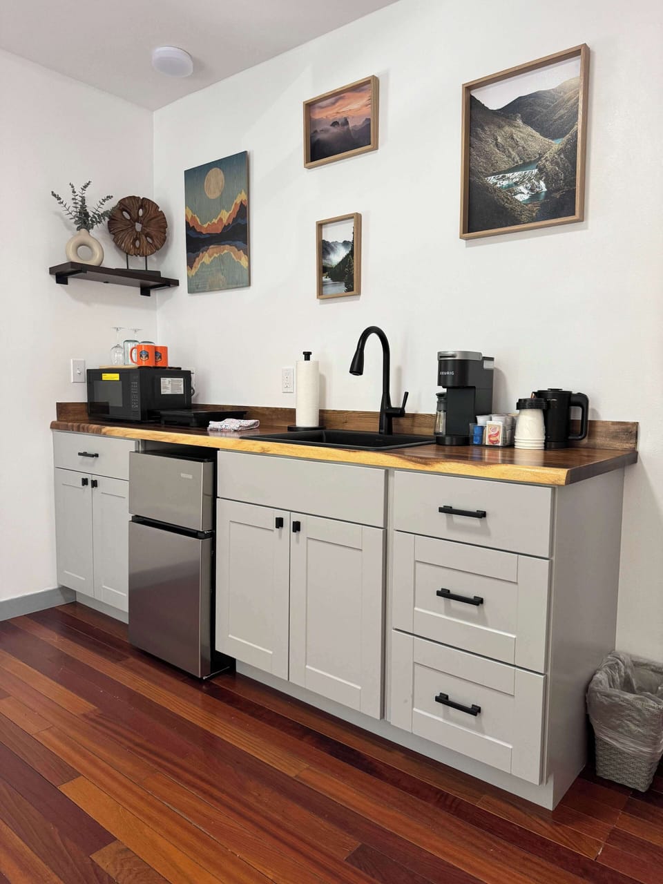 Thoughtfully designed kitchenette with modern appliances and warm details.