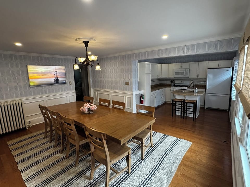 Dining room with seating for 10 and additional seating at the island