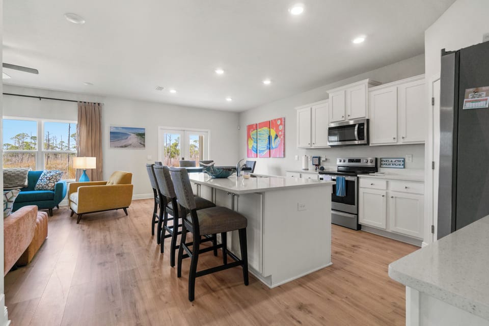 Your spacious open-concept living flows seamlessly from kitchen to lounge, creating the perfect space for cooking, dining, and relaxing together.