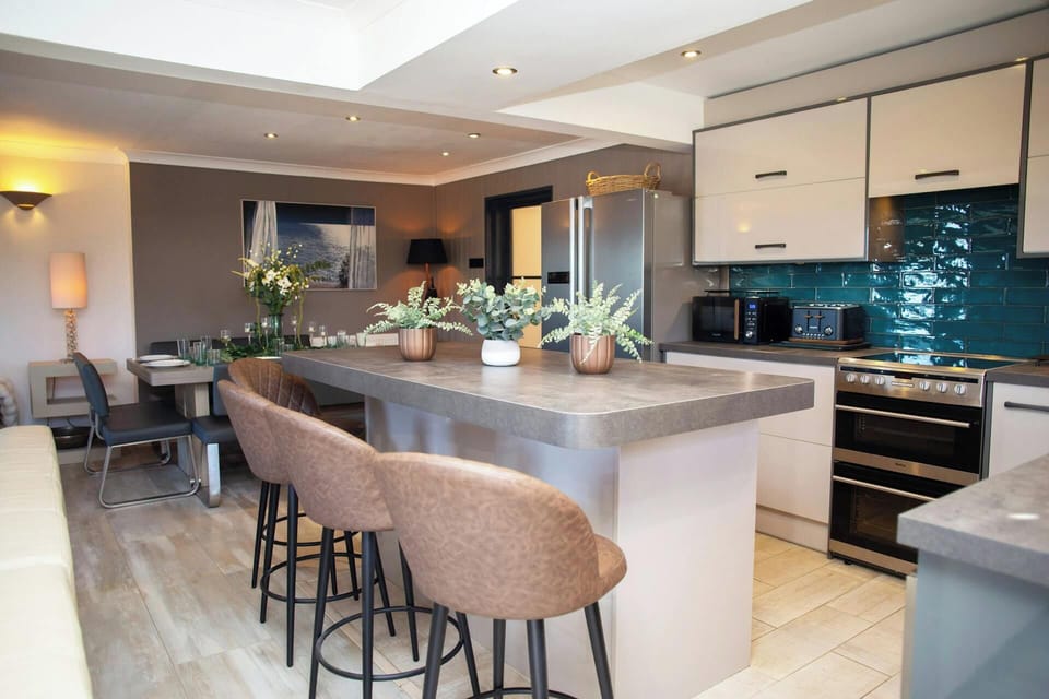 Kitchen with breakfast bar and stools