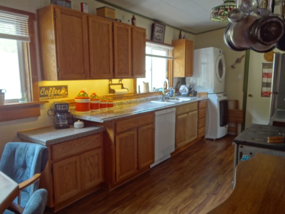 Kitchen picture with full coffee bar, DW, W/D & lots of lit counter space.