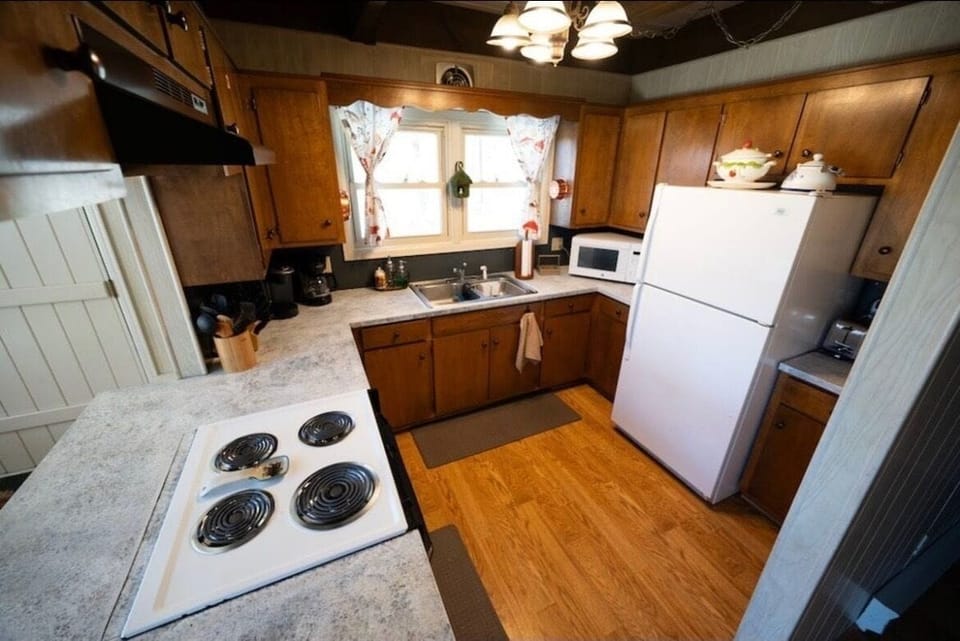 Kitchen is stocked with full fridge/freezer, stove, oven, air fryer, & microwave