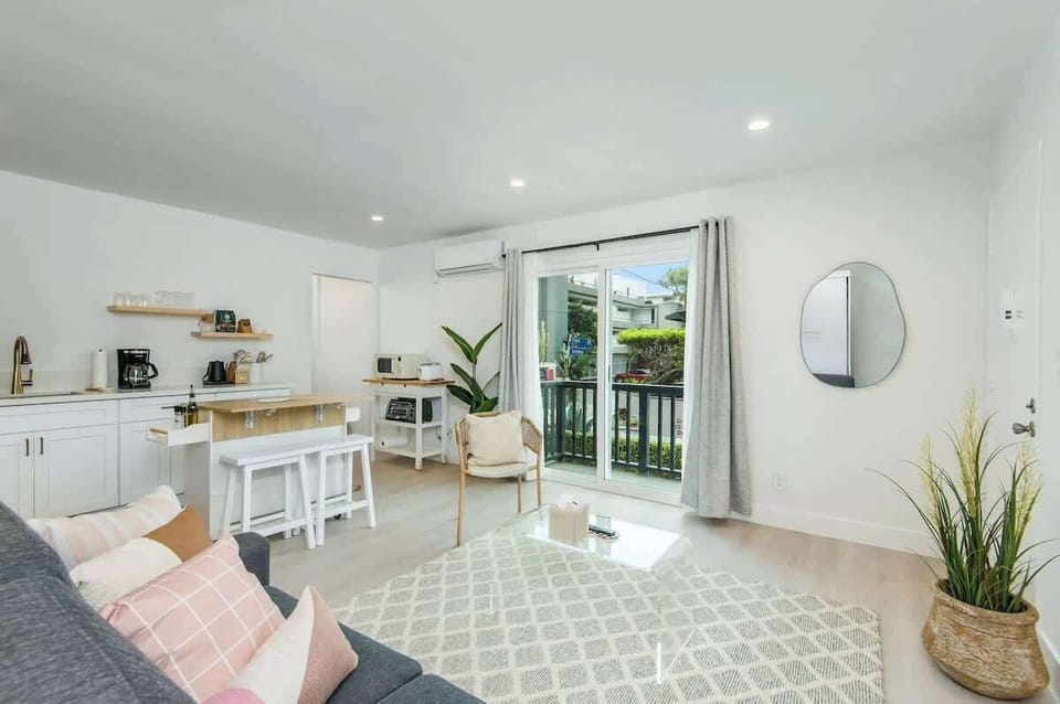 Open concept living room with balcony access.