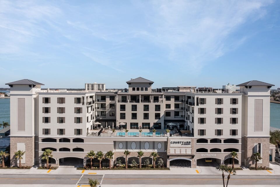 Arrive to a sleek waterfront hotel with resort-style energy.