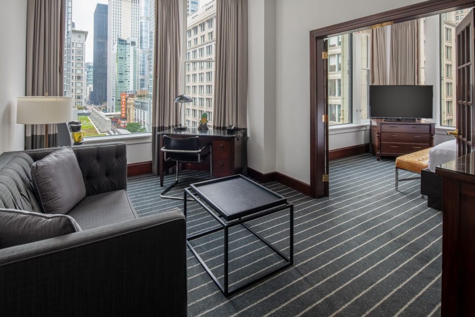 Unwind on the sofa while the skyline frames your stay.