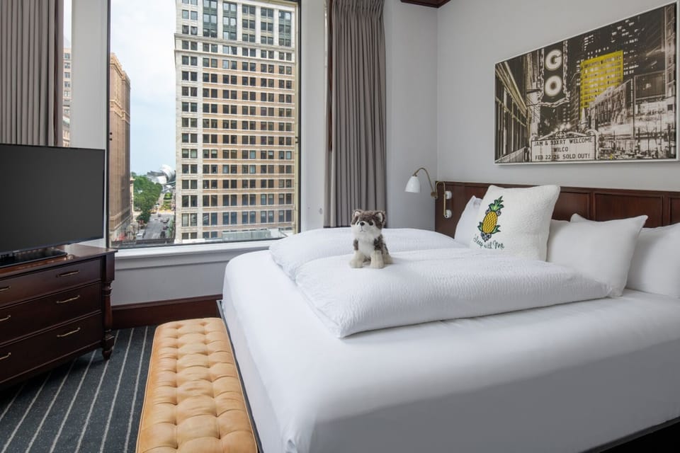 Sink into crisp linens and wake up to city views.
