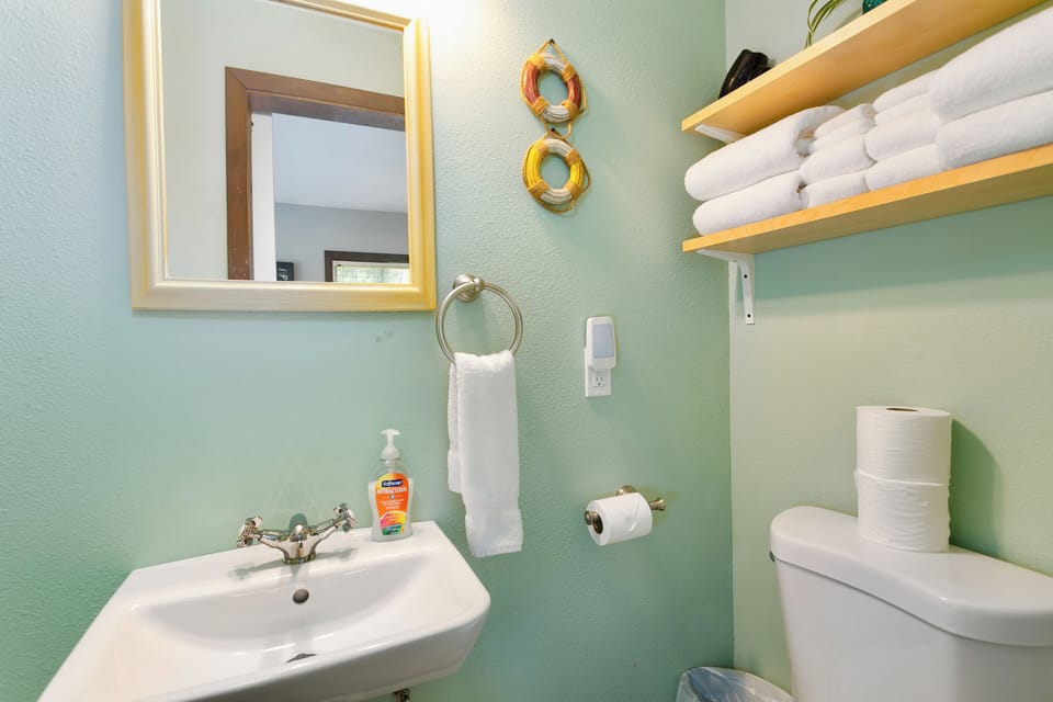 Simple, clean bathroom with fresh towels and everyday comforts