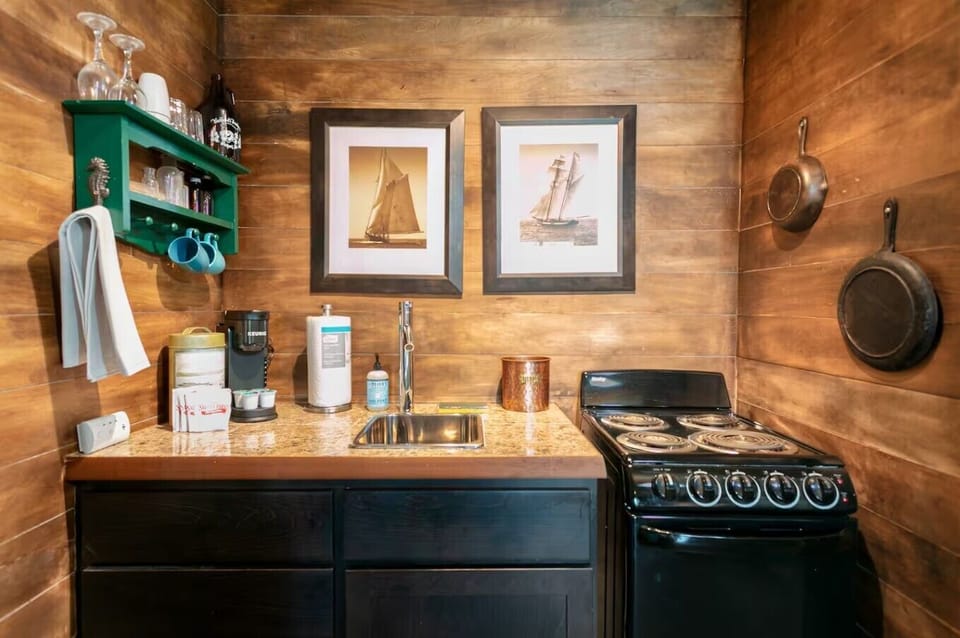 Cook up comfort in this charming cabin kitchen 🍳