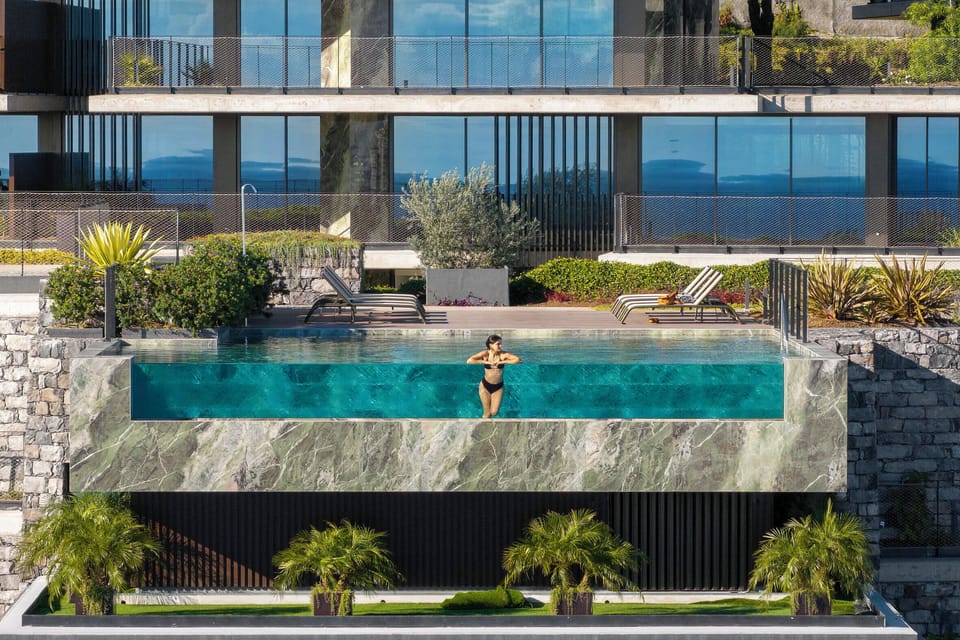 Communal swimming pool and sun loungers