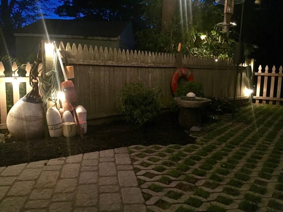 New patio and fire pit built into the rocks just to the left of the mooring ball.