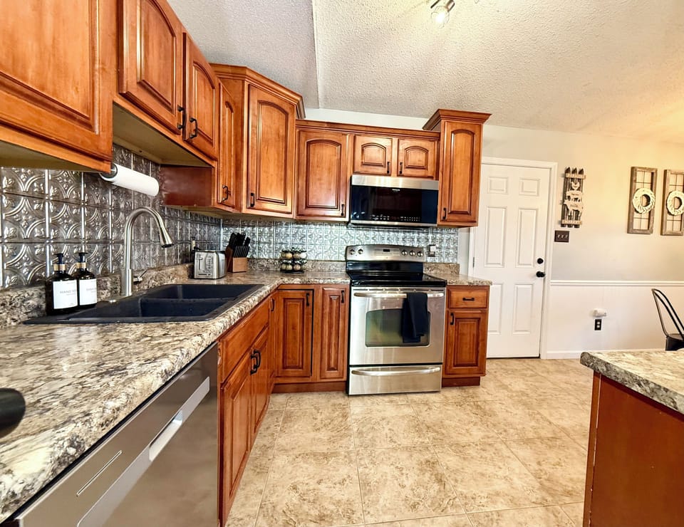 Large eat in kitchen with amenities to cook a snack or gourmet meal