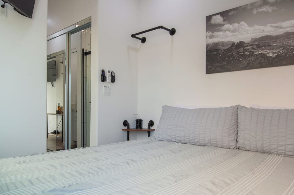 Bedroom with bedside shelves and lamps