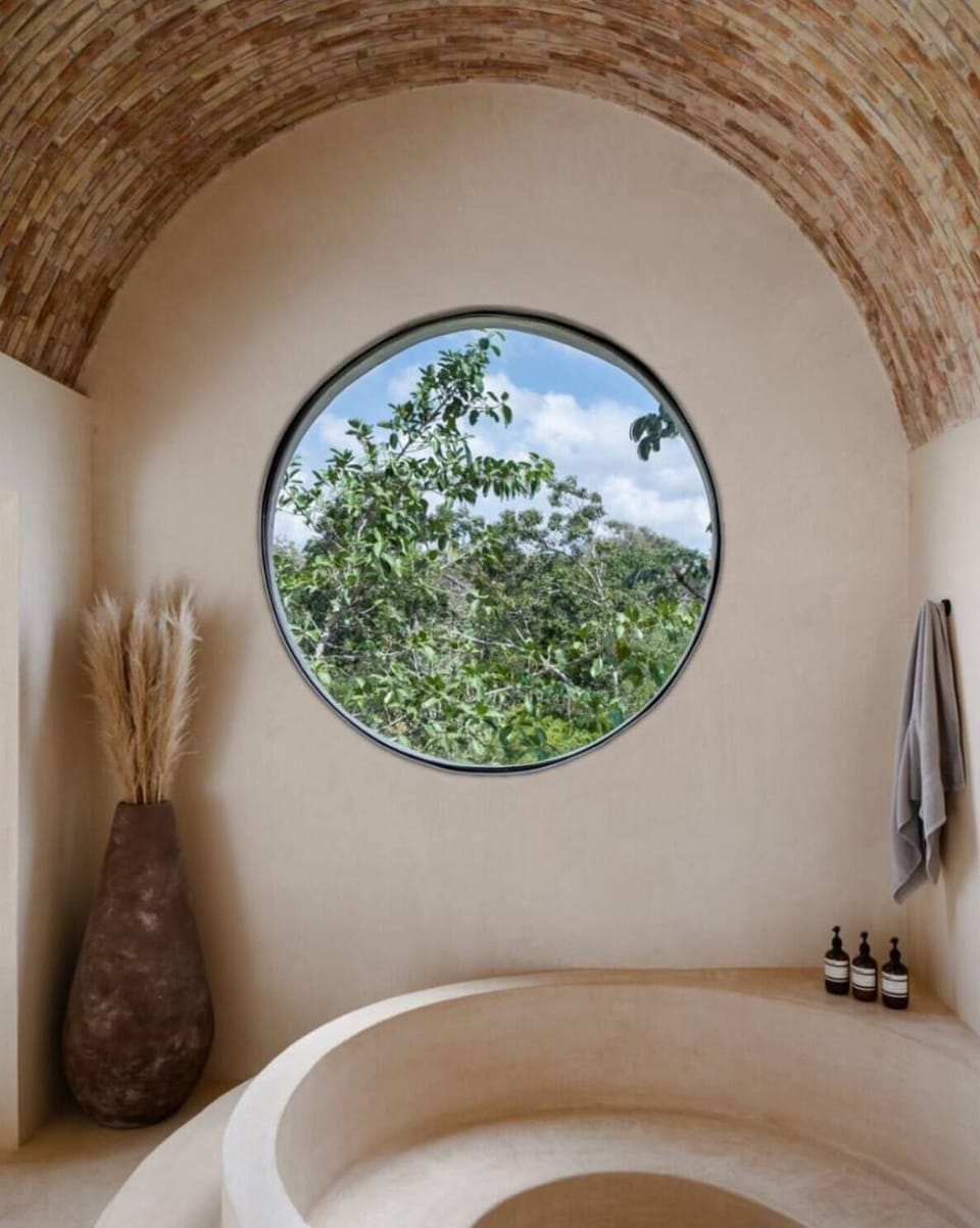 The Maya suite's 4 person hot tub with rainshower.