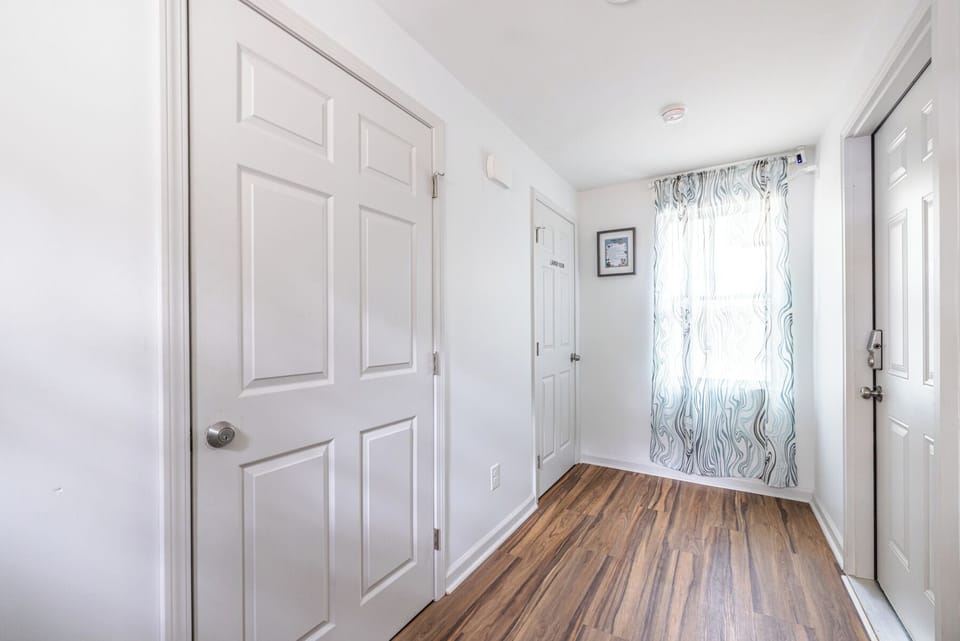 Guests have access to a shared washer and dryer, located in the interior hallway between the duplex units.