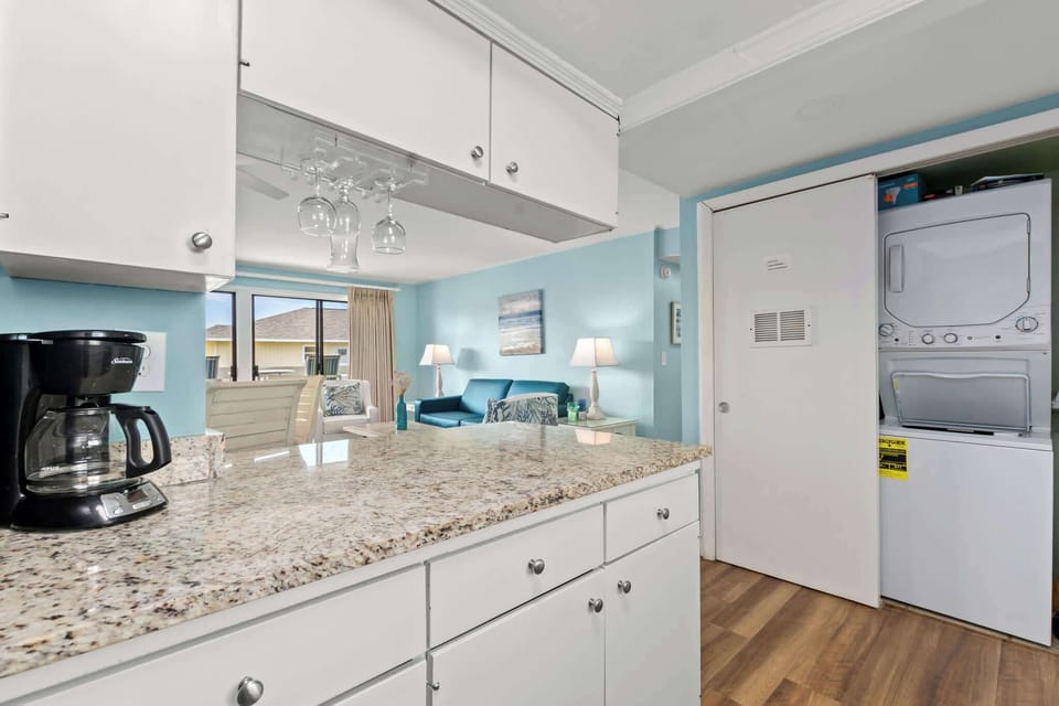 Cook, dine, and unwind in our open-concept kitchen and living area.