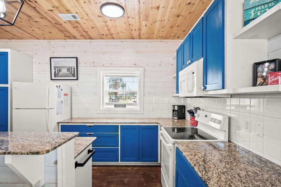The open, airy kitchen offers ample space & all the comforts of home