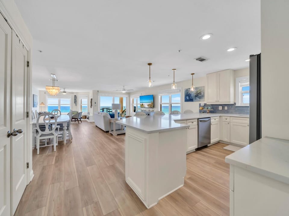 Gorgeous updated kitchen - new flooring, new quartz countertops, new backsplash