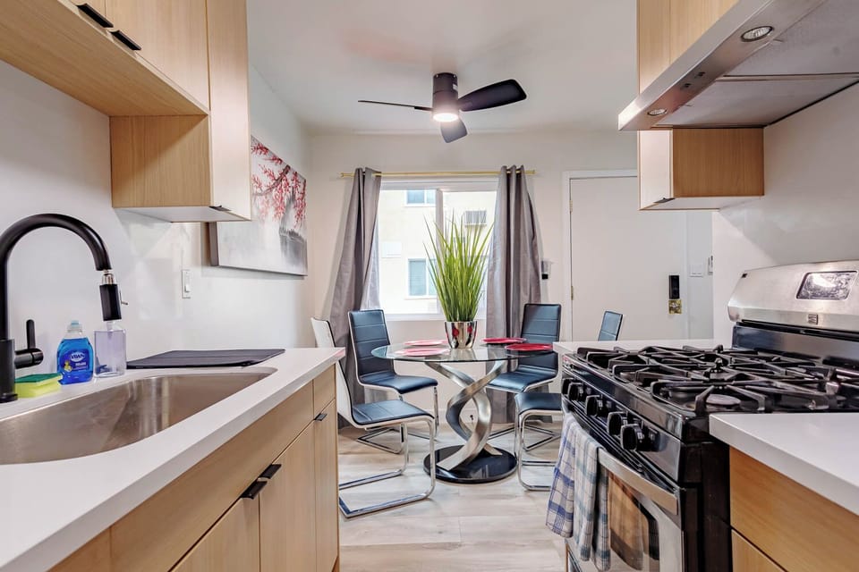 A seamless view from the kitchen into the bright dining area.