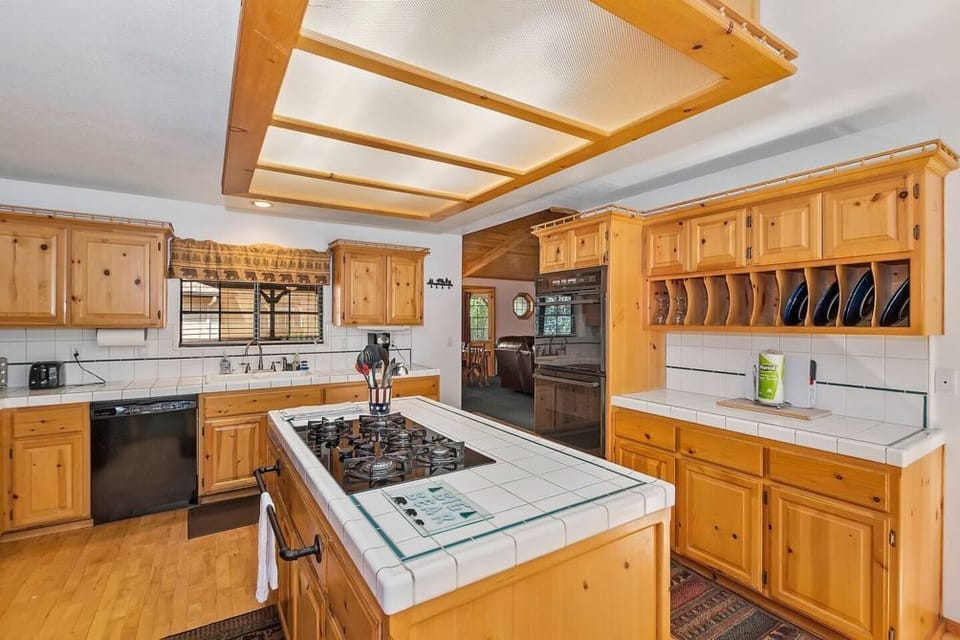 The cabin has a large kitchen area to make your favorite meals. All the major cooking appliances are provided, along with a dishwasher.