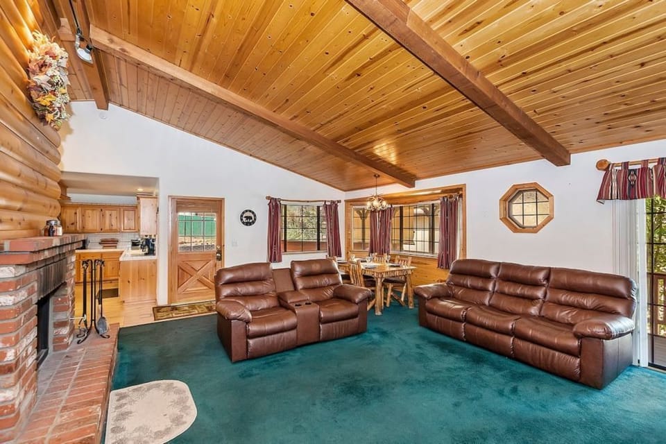 The cabin's open floor plan dining room and living room area.