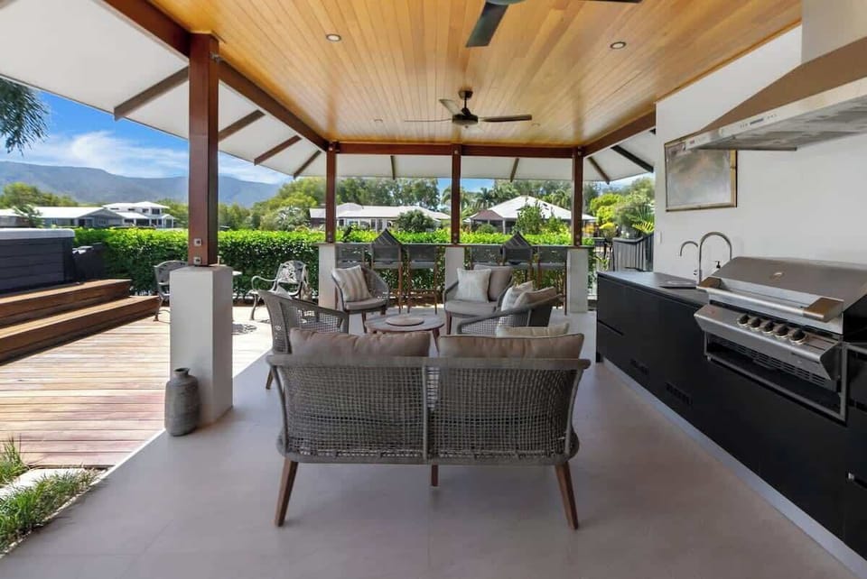 Fire up the built-in BBQ and enjoy a laid-back dining experience under the timber ceiling, with a sink nearby for easy meal prep and cleanup.