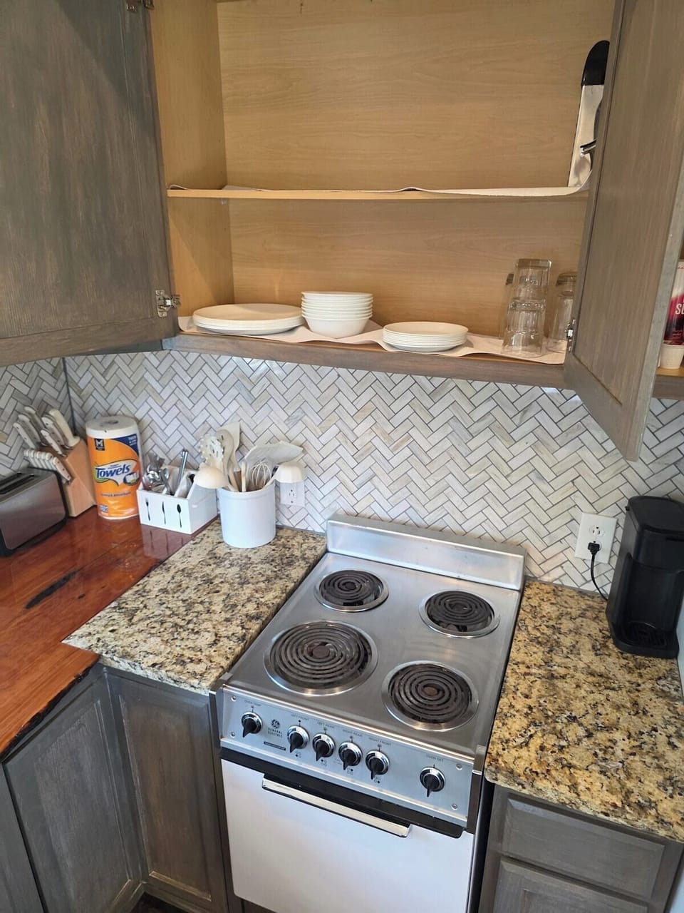 Toaster, knife block, and coffee corner.
