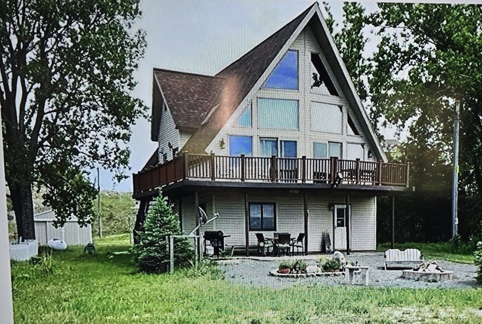 A Frame house. Lower level has bedroom, living room and rec room. 