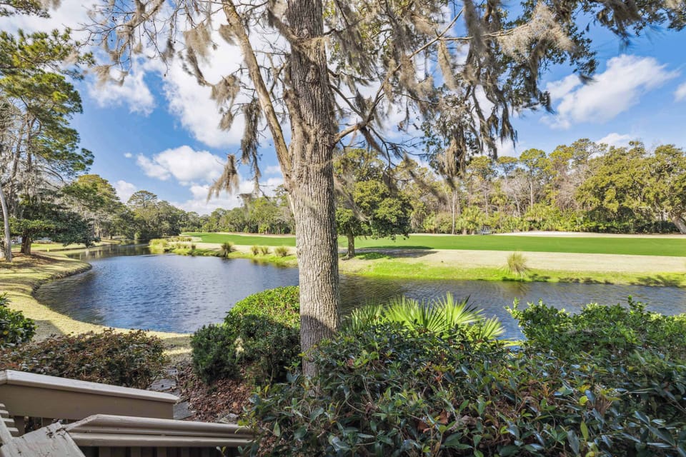 Patio with outdoor seating, grill, and gold course view