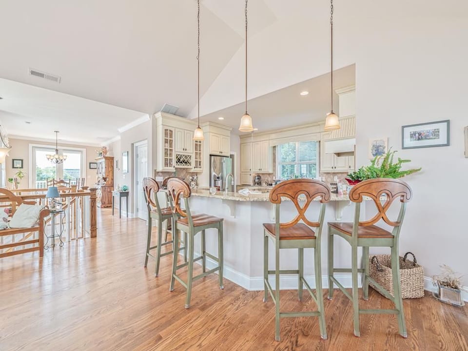Bright and airy breakfast bar with high-top seating, perfect for casual dining.